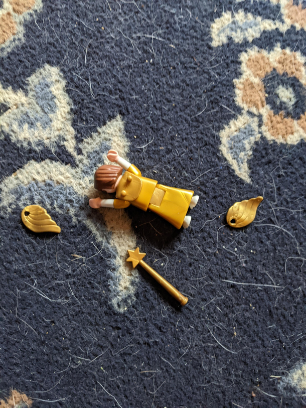 My toddler had no mercy for the angel from her toy nativity scene
