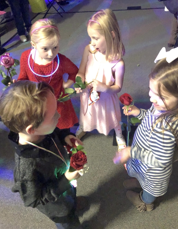 My  year old son had his first school dance tonight Got caught giving roses to different girls