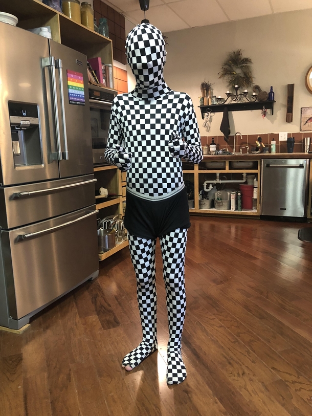 My  yr old autistic son dressed up as CheckerMan We insisted he put the underwear on because well he was  when he bought the costume