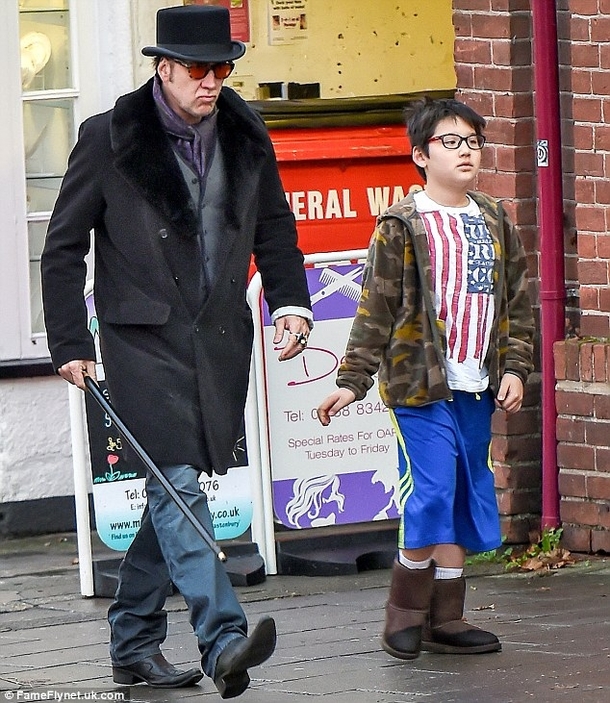 Nic Cage looks like hes shooting a movie even when hes just taking a walk