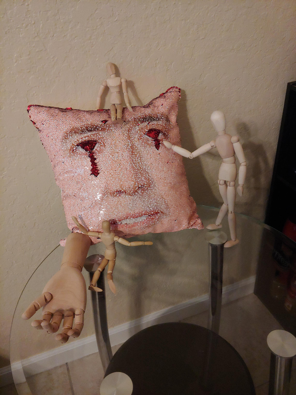 Nicholas Cage Pillow with sequins And my collection of mini mannequins I leave around the apartment to scare my roommatebest friend
