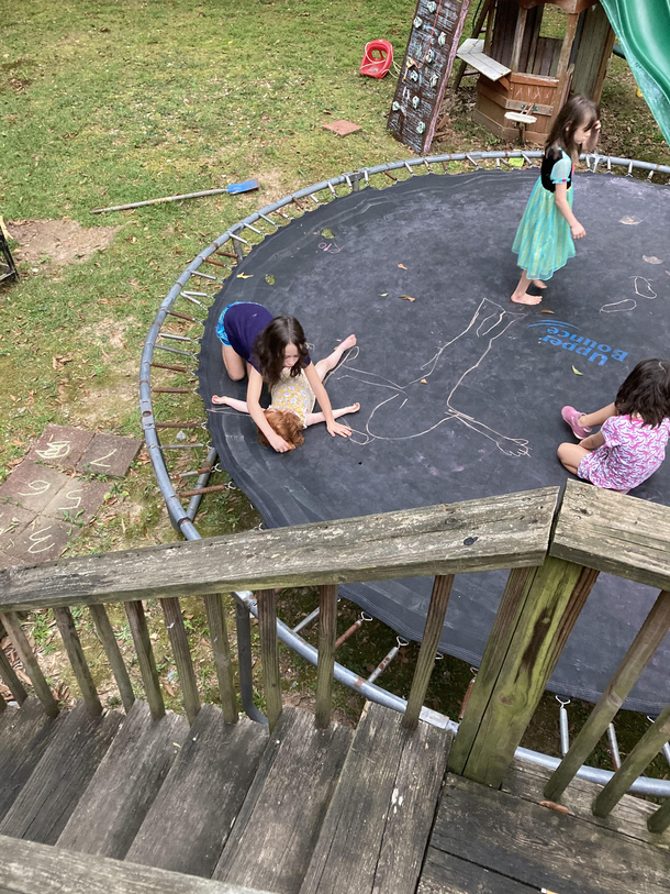 Not sure how I should feel about my daughters drawing chalk outlines of each other