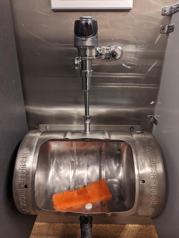 Noticed that the urinal at a local Brew-Pub was not only a keg but an Anheuser - Busch Keg