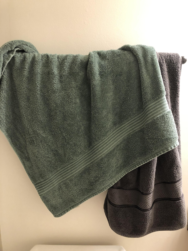 Our towels share a rod in the same manner we share the bed