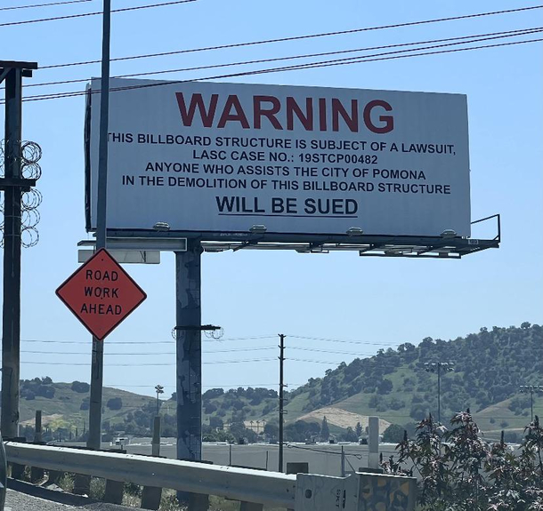 Overly litigious billboard CREDITS TO uPandazoic