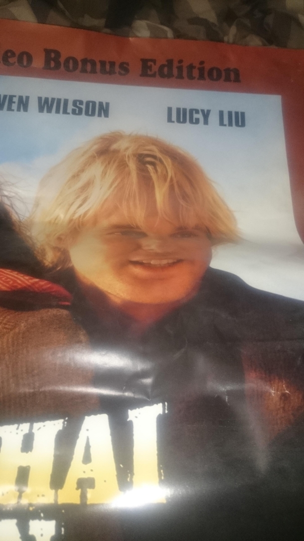 Owen Wilson looks like Annoying Orange on this bent movie poster