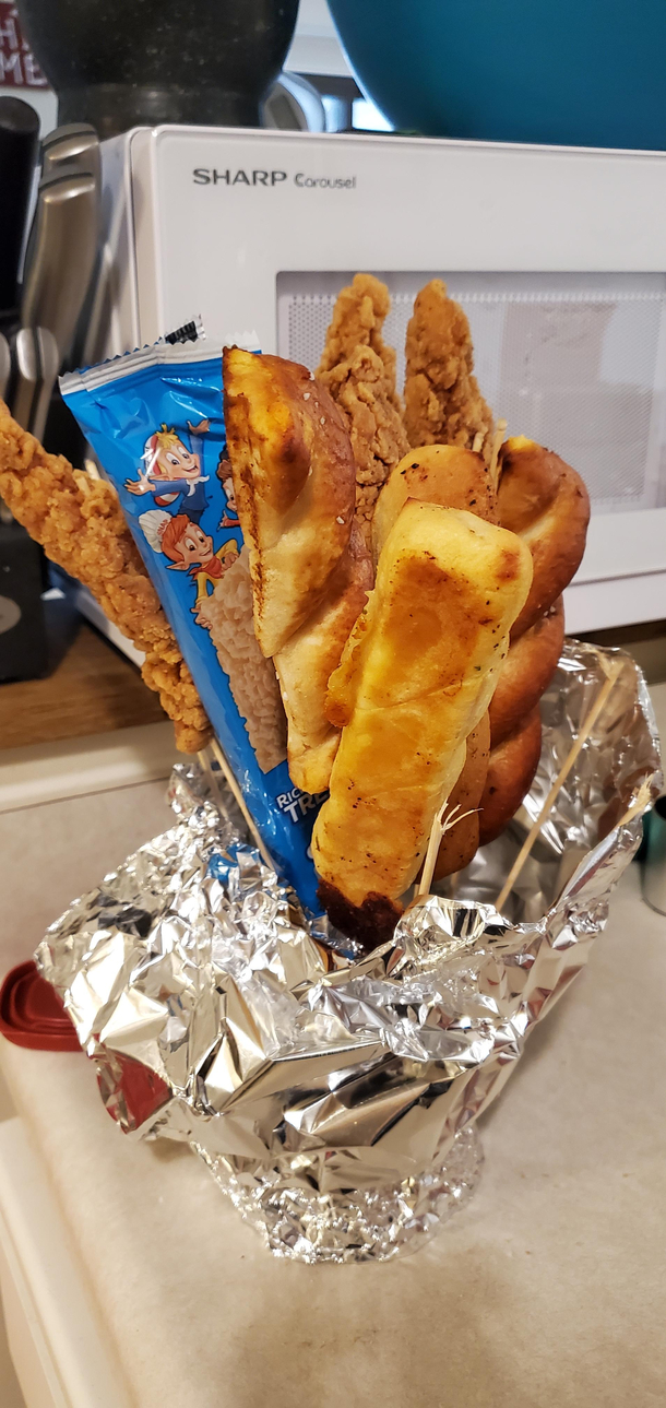 Partner hates normal V-Day trappings joked the only bouquet she wanted had chicken tenders amp breadsticks So thats what she got She loved it