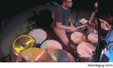 Patrick Wilson drummer for Weezer catches a frisbee during a show and never misses a beat
