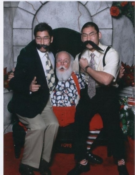 Pic #1 - Every year my friends visit the same Santa at the mall and take a photo with him Here is their latest