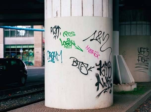 Pic #1 - Guy paints over graffiti with a more legible font