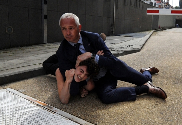 Pic #1 - Security choking a FEMEN activist in Brussels Notice the quality of the shoes Impressive