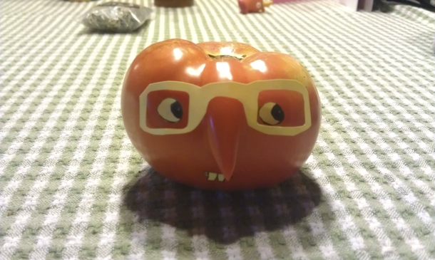 Pic #1 - We had a tomato with a strange growth My mom used a sticky note to make it into a nose