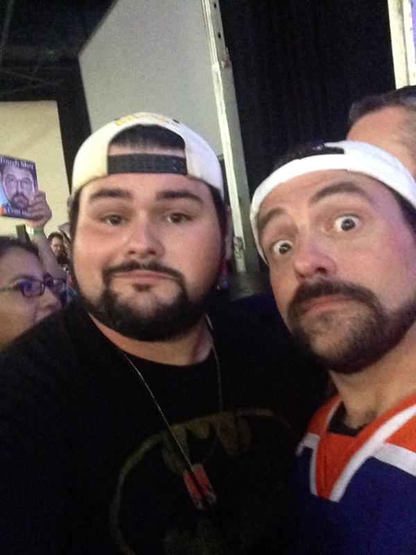 Pic #2 - I am pretty sure some unknown force is following Kevin Smith and giving him surprise Butt Sex during photo shoots