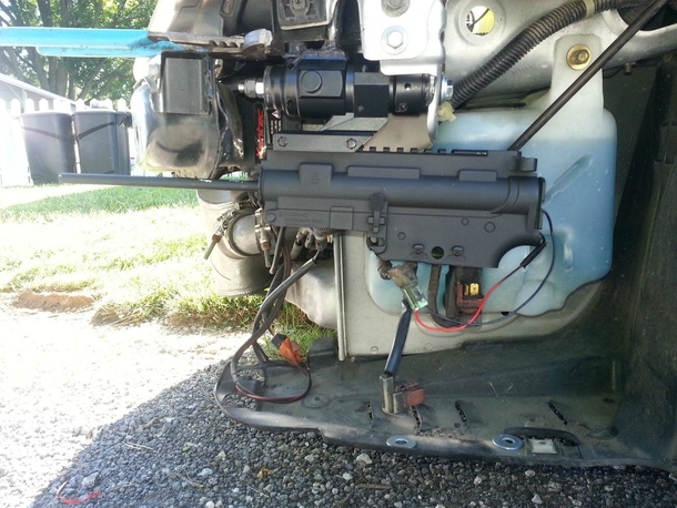 Pic #2 - My friend mounted a BB gun in his front bumper that he can fire while driving