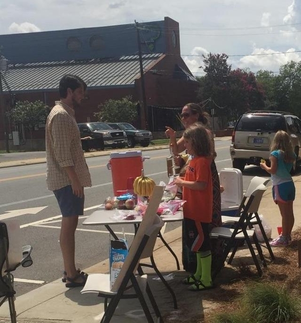 Pic #3 - Went to buy two cups of lemonade from a lemonade stand a group of ish year old girls set up next to our office to be a good person Turns out there was a surprise option the Mom was hiding under the table Happy Friday