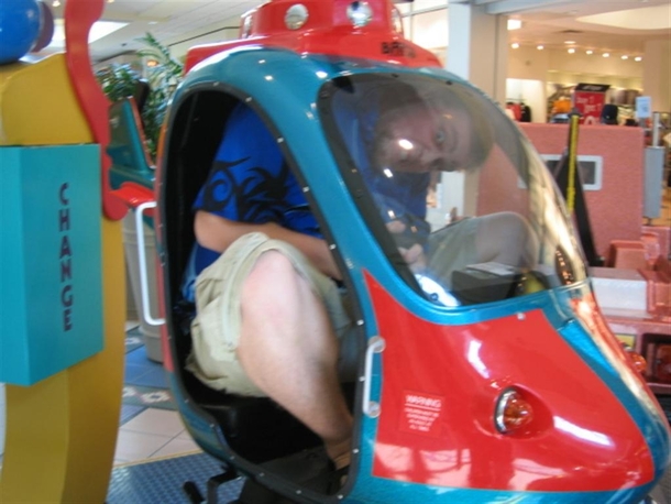 Pic #4 - Over the past few years I have been cramming myself into small childrens rides at the mall 