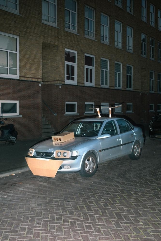 Pic #4 - This Guy Walks the Streets at Night Pimping Strangers Rides with Cardboard