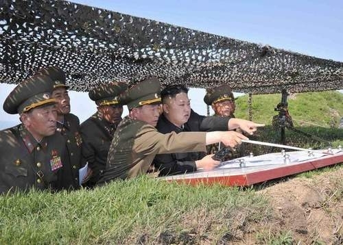 Pic #6 - Kim Jong Un looking at things