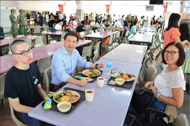 Pic of a conscript and his parents on his st day out of  at the Basic Military Training Centre Singapore