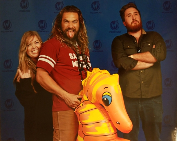 Picture of my fiancee being wisked away by Jason Mamoa at Wizard World