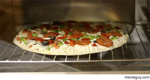 Pizza being cooked in an oven