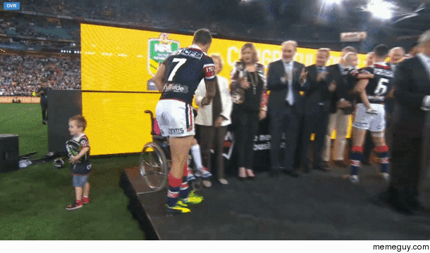 Players receiving their Rings after the Australian Rugby League Grand Final today one of the players kids decides to make his way up onto the stage