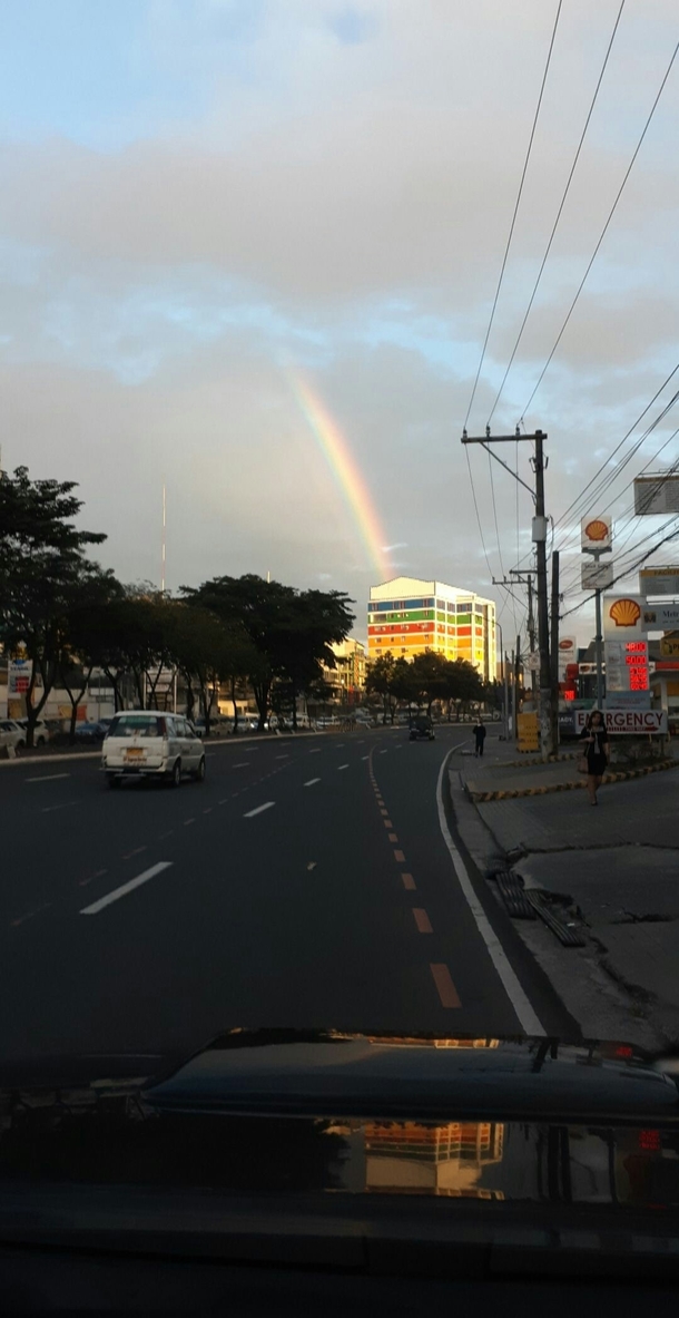 Rainbow touching a rainbow building
