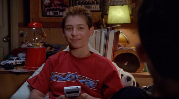 Reese playing Game Boy without a game in the slot