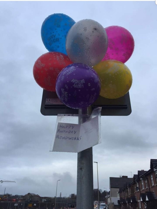 Roadworks near my house have been there for so long someone has put up a birthday card and balloons