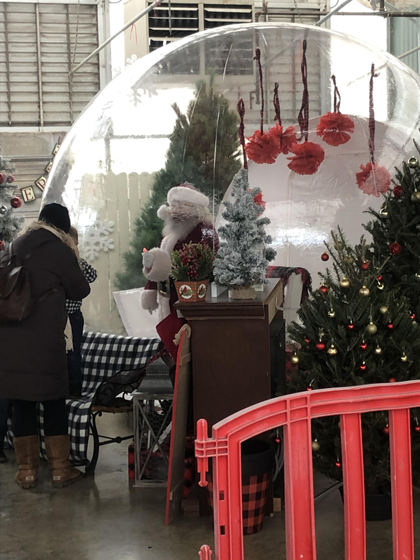 Santa in a snow globe pretty much wraps up  with a big freggin bow