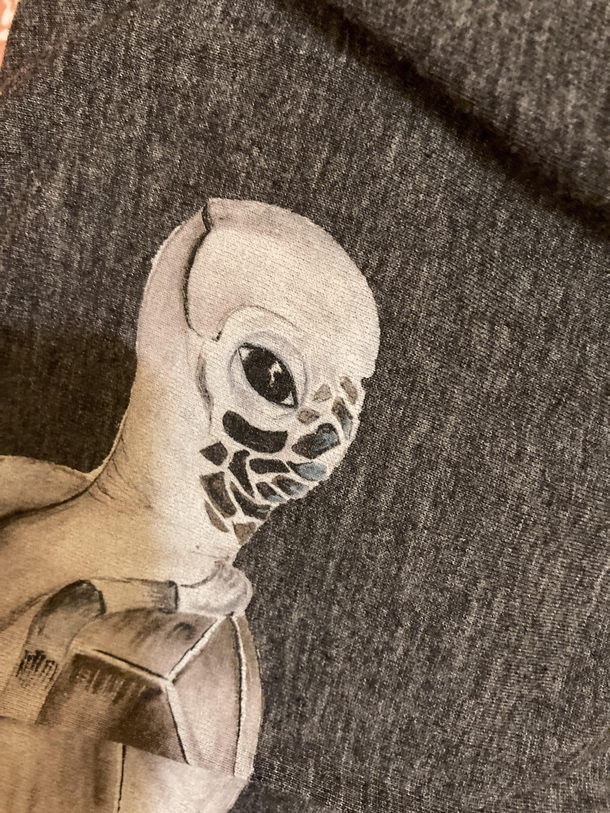 Saw this folded T-shirt and said to my wife Cool alien and she said Thats a sea turtle
