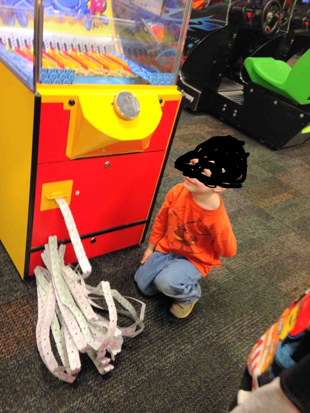 Saw this kid at Chuck E Cheese machine malfunctioned on his token the tickets rolled on for  mins This was his protective back-the-hell-up crouch He allowed nobody near the pile Even managers stayed away