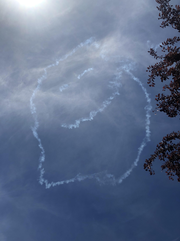 Say in my garden enjoying the sun heard a propped aircraft really giving it the gas Looked up and saw what was left of a smiley face