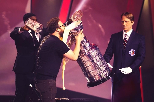 Seth Rogen Drinking Beer From The Stanley Cup