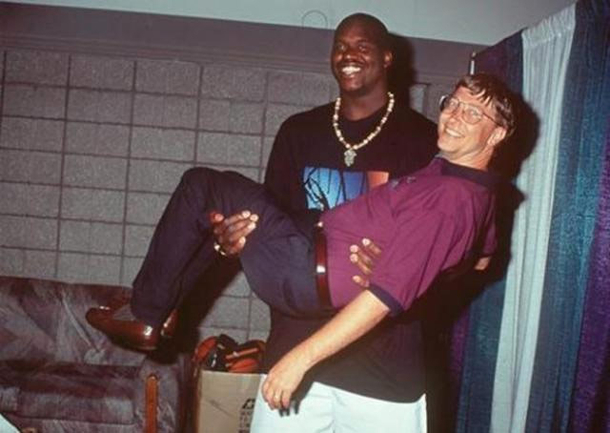 Shaq holding  billion in small Bills