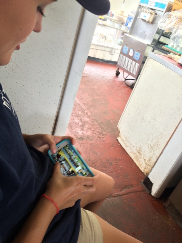 Shes playing a game where she works at an ice cream store while working at an ice cream store