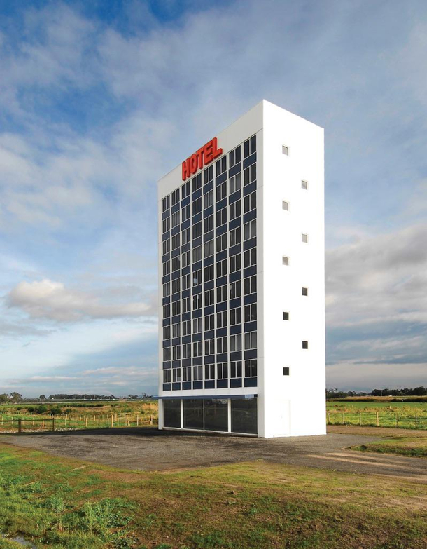 Shitty art installation down under Eastlink Hotel a  m tall fake hotel sculpture Cost  AUD million