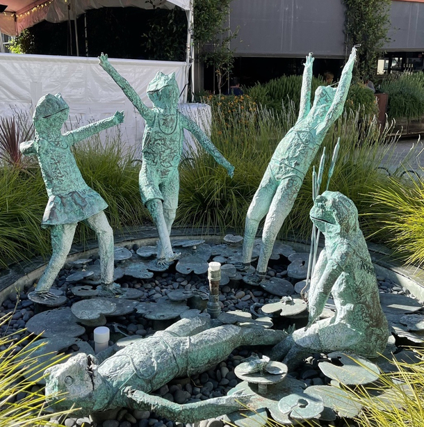 Since were sharing weird sculptures can I please introduce you to the bizarre frog-head sun-worshipping children at my local shopping center