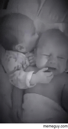Sister soothes her twin  weeks old brother