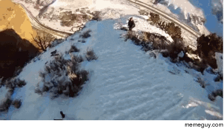 Skier front flips off cliff
