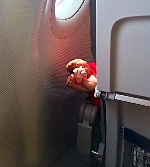So apparently theres a little kid in front of us on this flight