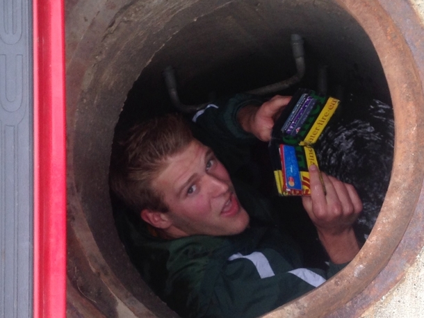 So I drop my wallet down a storm drain Devistated and in a fit of rage I kick it and the grate comes lose I am able to climb down and recover it During this a stranger walks by and takes this picture of me and I never saw him again I am the stranger