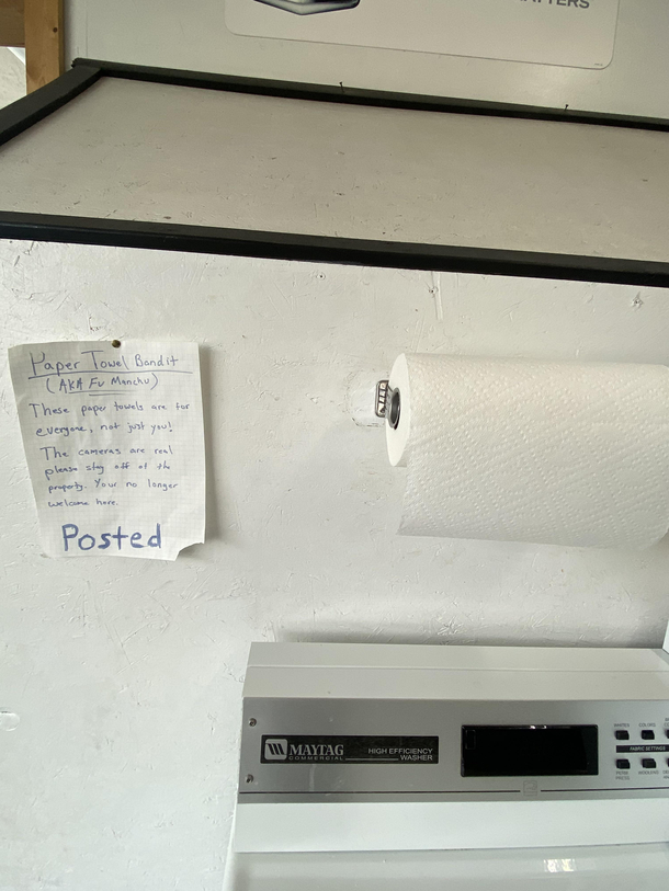Some one keeps stealing the paper towels from our laundry mat so they put up a sign