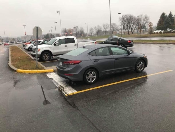 Someone apparently needs a little help in parking their car