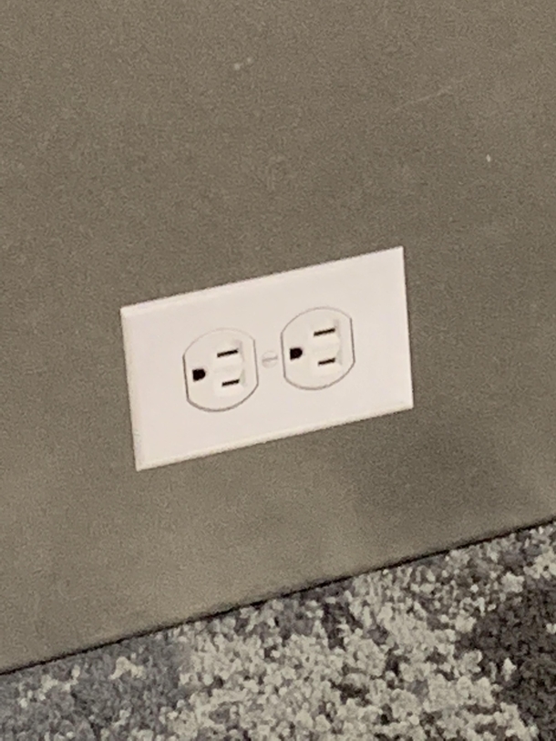 Someone at LAX put stickers on the wall that look VERY convincingly like power outlets