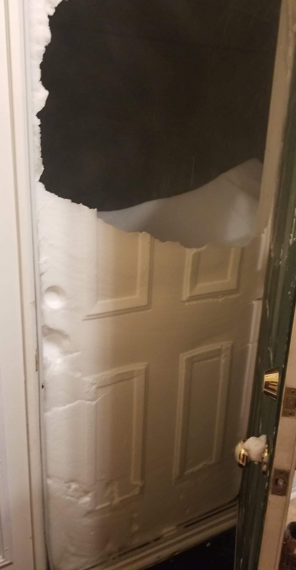 Someone broke my brother in laws door just kidding thats snow in Saint Johns Newfoundland