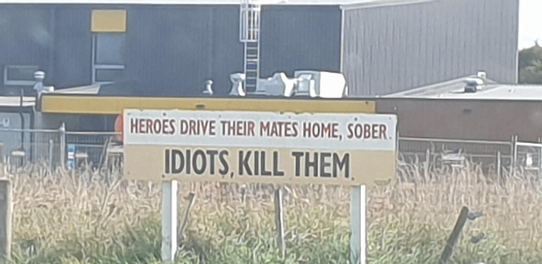 Someone defaced this sign by adding a comma