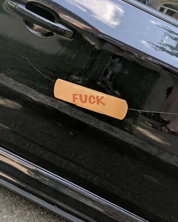 Someone in my neighborhood put this sticker over a scratch on their car