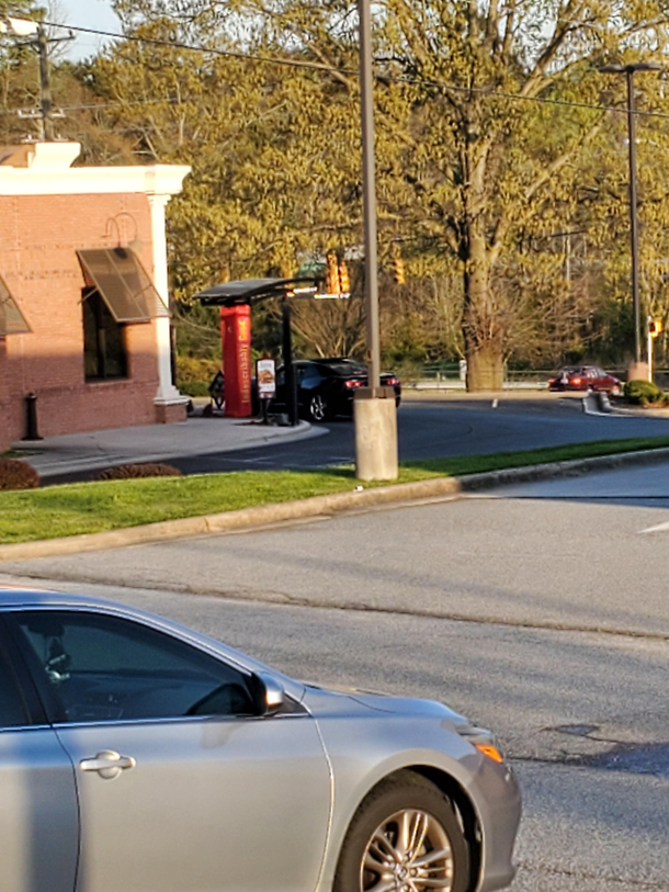 Someone is sitting at the Zaxbys drive-thru There is not a single car in the parking lot I wonder how long they will wait before they realize it is closed for Easter