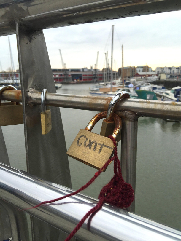 Someone really embracing the romantic spirit of putting a love lock on the bridge